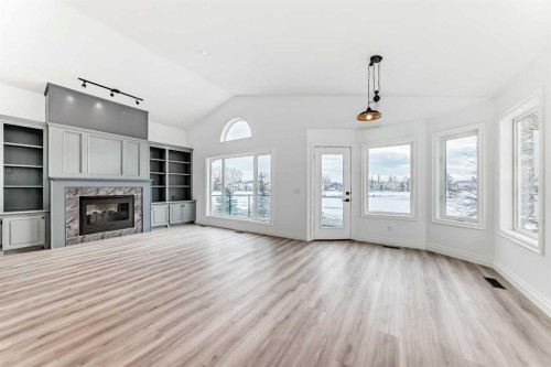 228 Woodside Crescent Nw, Airdrie, AB - Indoor With Fireplace