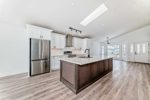 228 Woodside Crescent Nw, Airdrie, AB - Indoor Photo Showing Kitchen With Stainless Steel Kitchen