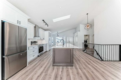 228 Woodside Crescent Nw, Airdrie, AB - Indoor Photo Showing Kitchen With Stainless Steel Kitchen With Upgraded Kitchen