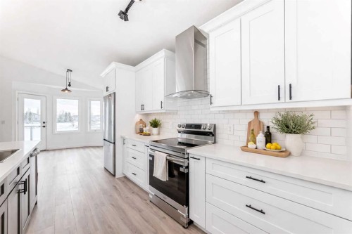 228 Woodside Crescent Nw, Airdrie, AB - Indoor Photo Showing Kitchen With Stainless Steel Kitchen With Upgraded Kitchen
