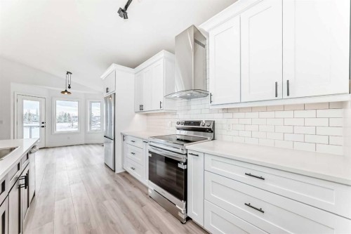 228 Woodside Crescent Nw, Airdrie, AB - Indoor Photo Showing Kitchen With Stainless Steel Kitchen With Upgraded Kitchen