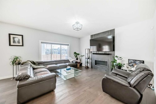2 Chelsea Bay, Chestermere, AB - Indoor Photo Showing Living Room With Fireplace