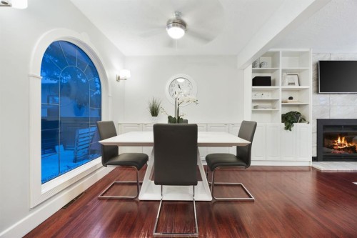 35 Grafton Drive Sw, Calgary, AB - Indoor Photo Showing Dining Room With Fireplace