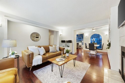 35 Grafton Drive Sw, Calgary, AB - Indoor Photo Showing Living Room With Fireplace