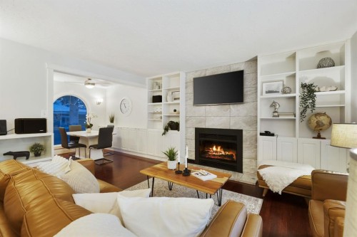35 Grafton Drive Sw, Calgary, AB - Indoor Photo Showing Living Room With Fireplace