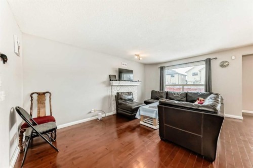 39 Saddleridge Close Ne, Calgary, AB - Indoor Photo Showing Living Room With Fireplace