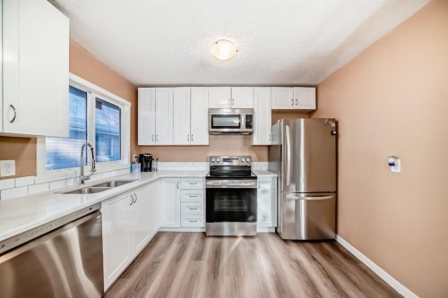3221 32A Avenue Se, Calgary, AB - Indoor Photo Showing Kitchen With Stainless Steel Kitchen With Double Sink