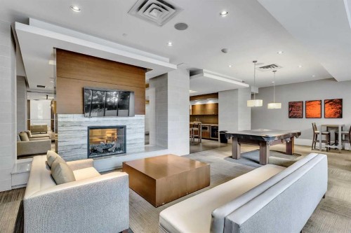 544-222 Riverfront Avenue Sw, Calgary, AB - Indoor Photo Showing Living Room With Fireplace