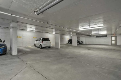 544-222 Riverfront Avenue Sw, Calgary, AB - Indoor Photo Showing Garage