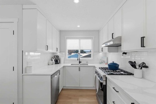 7107 54 Avenue Nw, Calgary, AB - Indoor Photo Showing Kitchen With Double Sink With Upgraded Kitchen