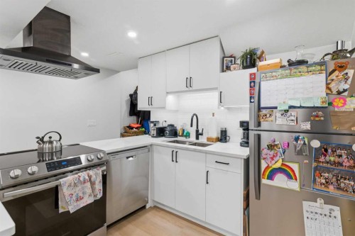 7107 54 Avenue Nw, Calgary, AB - Indoor Photo Showing Kitchen With Double Sink