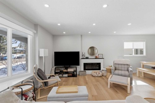 7107 54 Avenue Nw, Calgary, AB - Indoor Photo Showing Living Room With Fireplace
