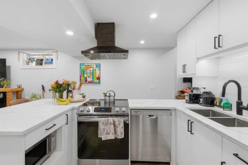 7107 54 Avenue Nw, Calgary, AB - Indoor Photo Showing Kitchen With Double Sink