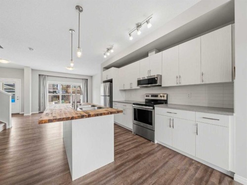 89 Walgrove Rise Se, Calgary, AB - Indoor Photo Showing Kitchen With Stainless Steel Kitchen With Double Sink