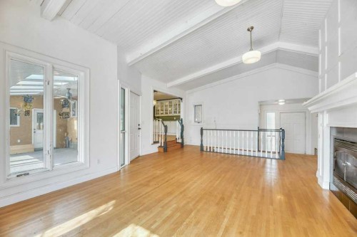 229 5 Avenue, Strathmore, AB - Indoor Photo Showing Other Room With Fireplace