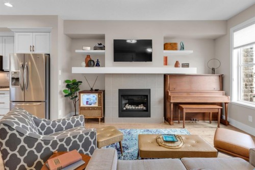 376 Quarry Park Boulevard Se, Calgary, AB - Indoor Photo Showing Living Room With Fireplace