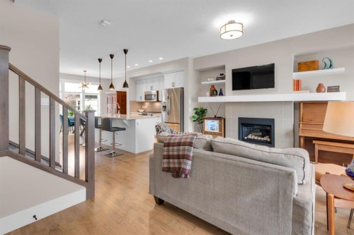 376 Quarry Park Boulevard Se, Calgary, AB - Indoor Photo Showing Living Room With Fireplace