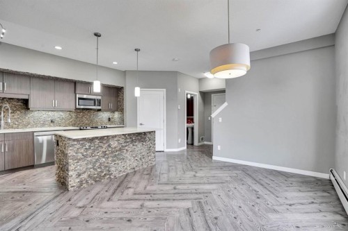 228-10 Westpark Link Sw, Calgary, AB - Indoor Photo Showing Kitchen With Upgraded Kitchen