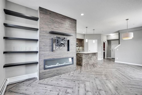 228-10 Westpark Link Sw, Calgary, AB - Indoor With Fireplace