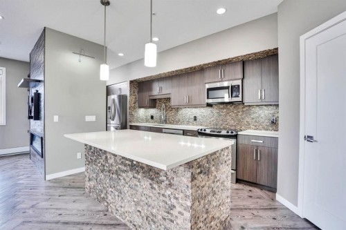 228-10 Westpark Link Sw, Calgary, AB - Indoor Photo Showing Kitchen With Upgraded Kitchen