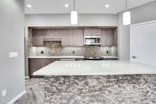 228-10 Westpark Link Sw, Calgary, AB - Indoor Photo Showing Kitchen With Upgraded Kitchen