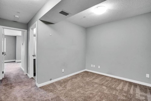 228-10 Westpark Link Sw, Calgary, AB - Indoor Photo Showing Other Room