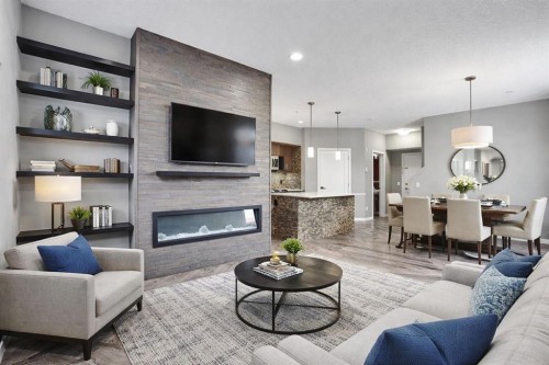 228-10 Westpark Link Sw, Calgary, AB - Indoor Photo Showing Living Room With Fireplace