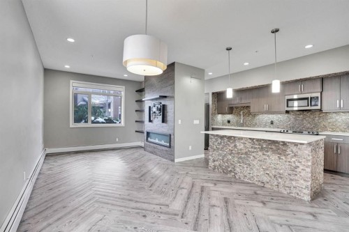 228-10 Westpark Link Sw, Calgary, AB - Indoor Photo Showing Kitchen With Upgraded Kitchen