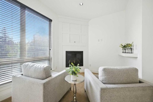 62 Posthill Drive Sw, Calgary, AB - Indoor Photo Showing Living Room With Fireplace