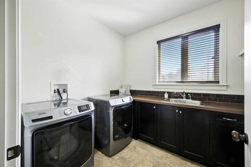 62 Posthill Drive Sw, Calgary, AB - Indoor Photo Showing Laundry Room