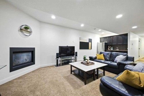 62 Posthill Drive Sw, Calgary, AB - Indoor Photo Showing Living Room With Fireplace