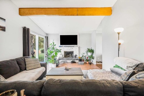 5112 Maryvale Drive Ne, Calgary, AB - Indoor Photo Showing Living Room With Fireplace