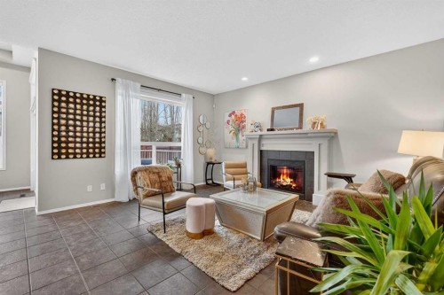 201 Autumn Circle Se, Calgary, AB - Indoor Photo Showing Living Room With Fireplace