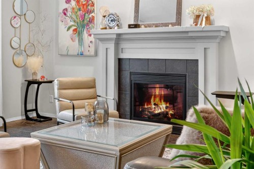 201 Autumn Circle Se, Calgary, AB - Indoor Photo Showing Living Room With Fireplace