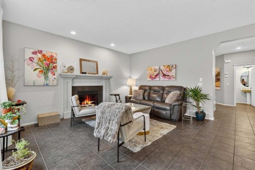 201 Autumn Circle Se, Calgary, AB - Indoor Photo Showing Living Room With Fireplace
