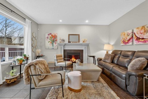 201 Autumn Circle Se, Calgary, AB - Indoor Photo Showing Living Room With Fireplace