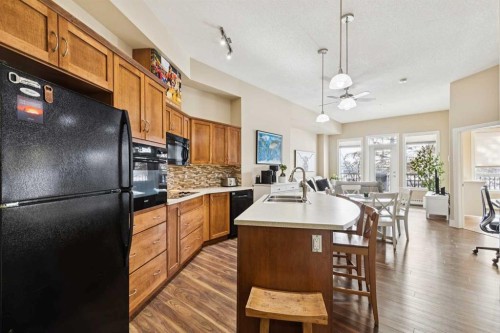 103-3101 34 Avenue Nw, Calgary, AB - Indoor Photo Showing Kitchen With Double Sink