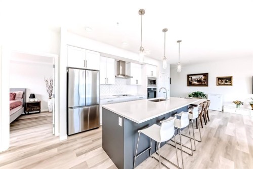 1402-33 Carringham Gate Nw, Calgary, AB - Indoor Photo Showing Kitchen With Stainless Steel Kitchen With Double Sink With Upgraded Kitchen