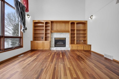 90 Hawkmount Green Nw, Calgary, AB - Indoor Photo Showing Living Room With Fireplace