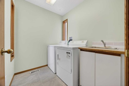 90 Hawkmount Green Nw, Calgary, AB - Indoor Photo Showing Laundry Room