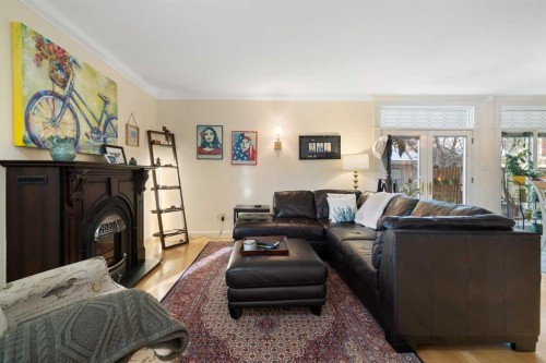 1727 24 Street Sw, Calgary, AB - Indoor Photo Showing Living Room With Fireplace