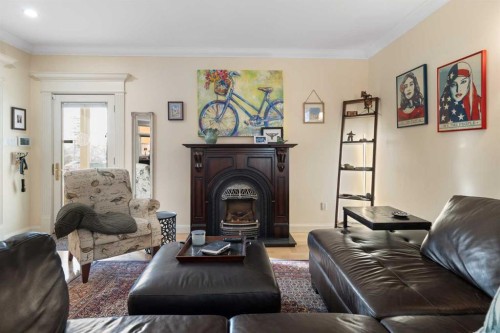 1727 24 Street Sw, Calgary, AB - Indoor Photo Showing Living Room With Fireplace