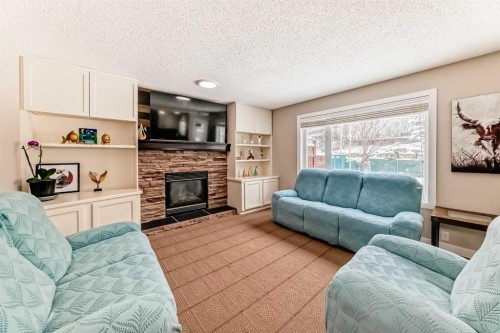 212 Sienna Park Drive Sw, Calgary, AB - Indoor Photo Showing Living Room With Fireplace