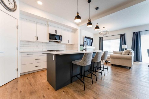 244 Heritage Heights, Cochrane, AB - Indoor Photo Showing Kitchen With Upgraded Kitchen