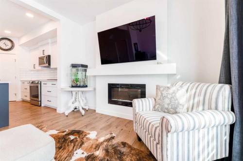244 Heritage Heights, Cochrane, AB - Indoor Photo Showing Living Room With Fireplace