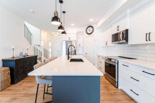 244 Heritage Heights, Cochrane, AB - Indoor Photo Showing Kitchen With Upgraded Kitchen