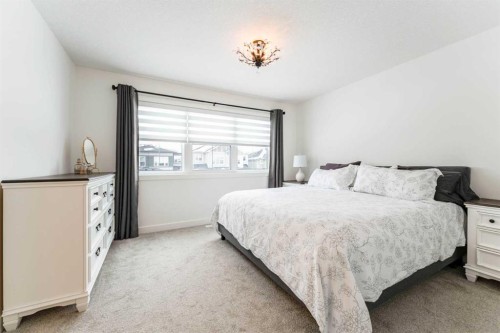244 Heritage Heights, Cochrane, AB - Indoor Photo Showing Bedroom