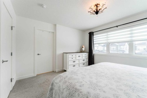 244 Heritage Heights, Cochrane, AB - Indoor Photo Showing Bedroom