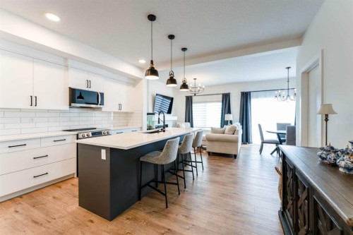 244 Heritage Heights, Cochrane, AB - Indoor Photo Showing Kitchen With Upgraded Kitchen