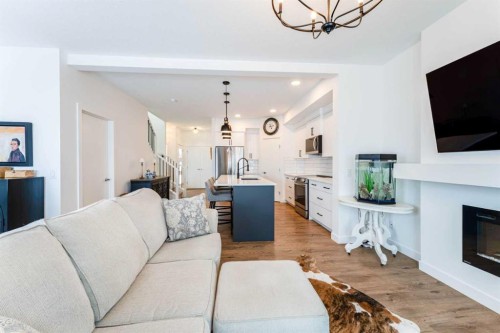 244 Heritage Heights, Cochrane, AB - Indoor Photo Showing Living Room With Fireplace